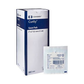 Box of Curity sterile gauze pads with single packaged gauze pad, medical supply.