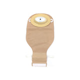 Beige ostomy pouch with adhesive barrier for medical stoma care on white background