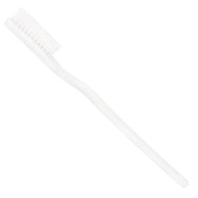 white disposable toothbrush for personal oral hygiene on plain background