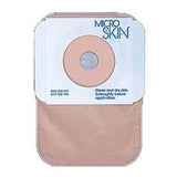 Ostomy pouch with skin barrier, transparent medical adhesive, and circular cutout for stoma care