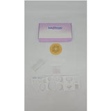 Ostomy care kit with stoma barrier, measuring guide, and accessories on white background