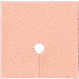 Square beige ostomy barrier with central hole and slit, medical supply for stoma care