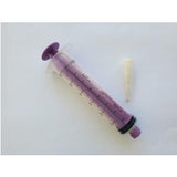 Purple medical syringe with clear dosage markings and a separate white adapter on white background