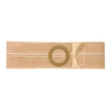 Medical ostomy barrier strip with central adhesive opening, beige color, flat background