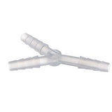 Clear plastic three-way medical tubing connector on white background