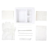 Sterile medical dressing change kit with gloves, tray, gauze pads, and swabs on white background