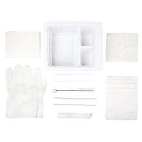 Sterile medical dressing change kit with gloves, tray, gauze pads, and swabs on white background