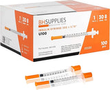 Box of insulin syringes 30G 1ml with orange caps, two syringes in front.