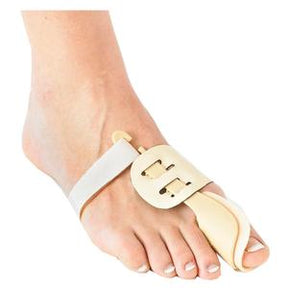 Foot wearing a beige bunion corrector splint for toe alignment and pain relief