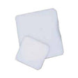 Two sterile medical gauze pads on a white background, wound care supplies