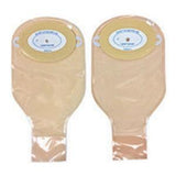 Two beige ostomy bags with adhesive flanges for medical use on a white background