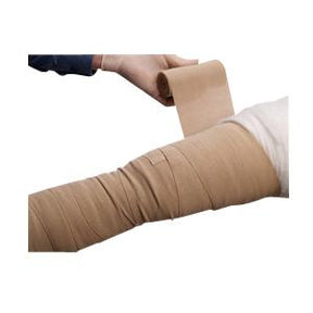 Person wrapping elastic compression bandage around arm for medical support