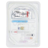 Sterile medical catheter kit with syringe, tube, scalpel, and packaged accessories in plastic tray