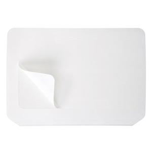 Rectangular white adhesive medical patch with a peeled corner on a plain background