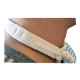 Adjustable white tracheostomy tube neck strap on person's neck for medical use