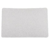 White rectangular absorbent medical pad on plain background