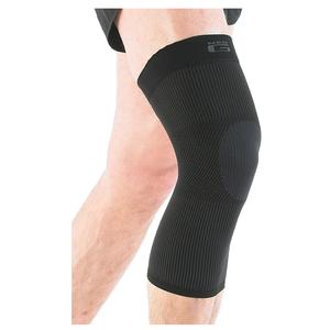 Black knee compression sleeve worn on leg, orthopedic support for joint pain relief