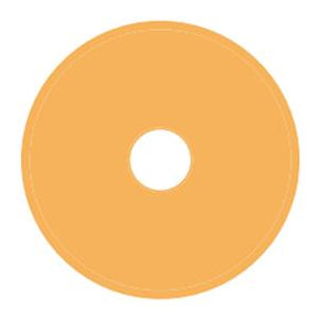 Beige circular medical hydrocolloid adhesive barrier with central hole for ostomy care