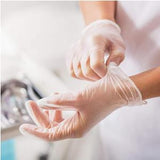 Person putting on disposable medical gloves for healthcare or home medical use