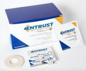 Conforming adhesive ostomy ring kit with packaging and medical supplies on white background.