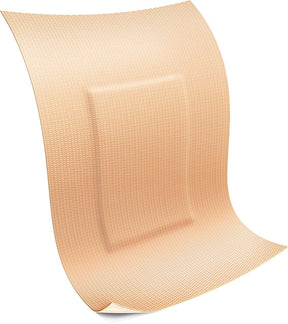 Large beige adhesive bandage for wound care and medical dressing on white background