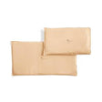 Two beige reusable gel ice packs for medical use on white background