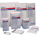 Assorted medical dressing supplies in sterile packaging, various sizes for wound care
