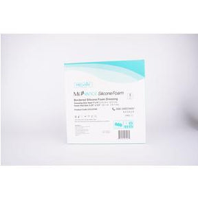 Box of bordered silicone foam medical dressing on white background, wound care supply