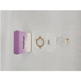 Stoma care kit with ostomy pouch, sealing ring, and packaging on white background