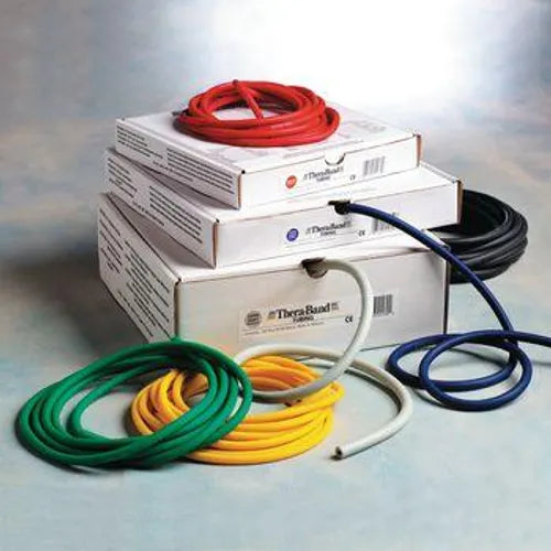 Assorted resistance exercise bands in various colors on stacked boxes for physical therapy