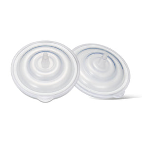 Clear plastic backflow protectors for breast pump accessories on white background