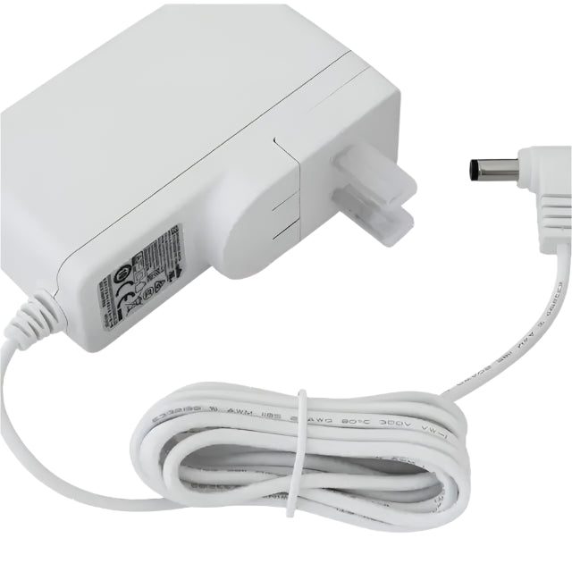 White medical device power adapter with coiled cable and standard DC plug