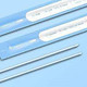 Sterile medical swabs in blue foil packaging on light blue background