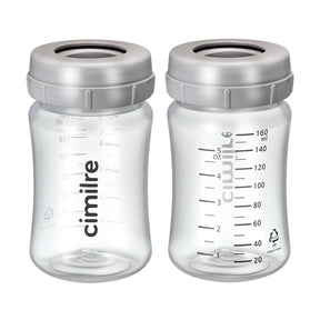 Two clear plastic breast milk storage bottles with measurement markings and grey lids