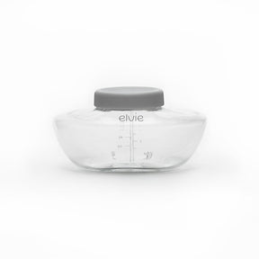 Clear Elvie breast milk storage container with gray lid on white background