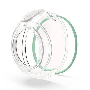 Clear reusable breast pump cup with green silicone ring on white background