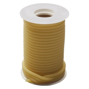 Yellow medical-grade tubing coiled on a white spool for medical supplies