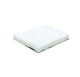 Stack of white non-sterile medical gauze sponges on a plain background