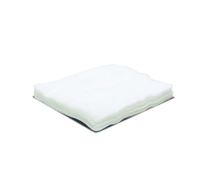 Stack of white non-sterile medical gauze sponges on a plain background