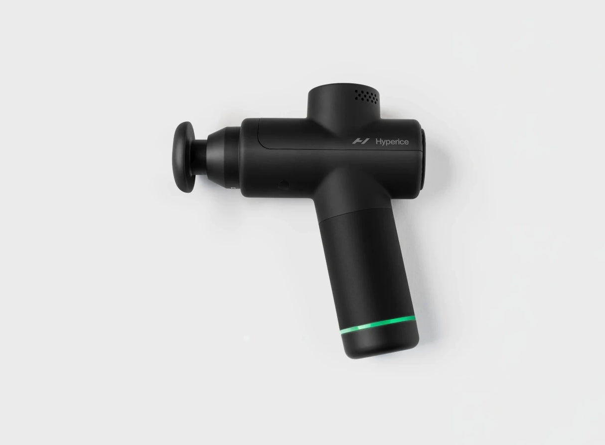 Black handheld percussion massage gun with green accent on white background