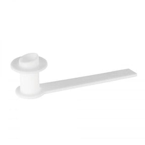 White plastic medical adapter with extended tab on a plain background