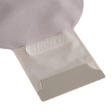 Close-up of a medical ostomy pouch with adhesive closure on a white background