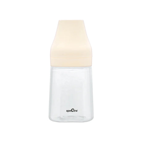 Clear plastic baby bottle with beige cap, suitable for infant feeding and accessories kits