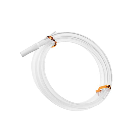 Coiled clear medical tubing with connectors against a white background