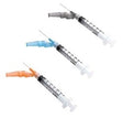 Three medical syringes with needle caps in blue, orange, and gray on a white background.