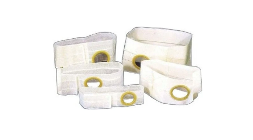 Assorted ostomy belts with stoma openings, white medical supplies on white background