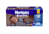 Box of Huggies OverNites diapers with sleeping baby and product details on packaging