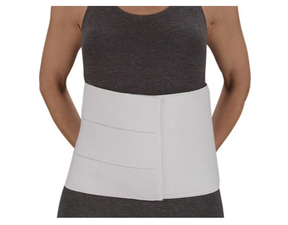 Person wearing a white abdominal binder for medical support