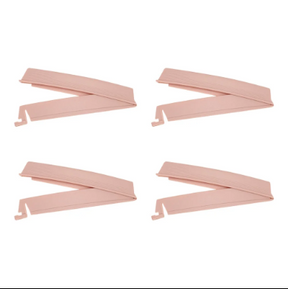 Set of four pink medical supply clips on a white background