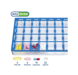 Weekly pill organizer with assorted vitamins, capsules, fish oil, and aspirin.